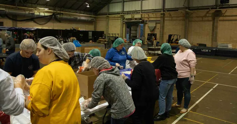 Volunteers packing meals