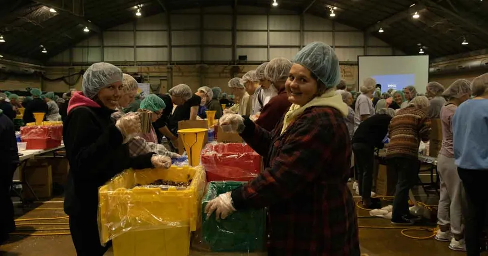 Volunteers packing meals